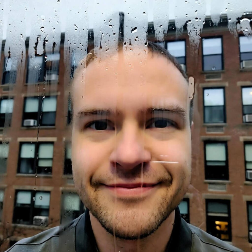 Rainy window, stressed smirk reflection.