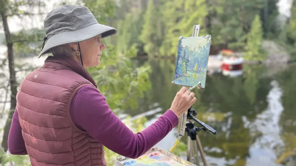 Cluttered coffee shop pondering failures, with heart-shaped spill for that wry humor in my daily grinds