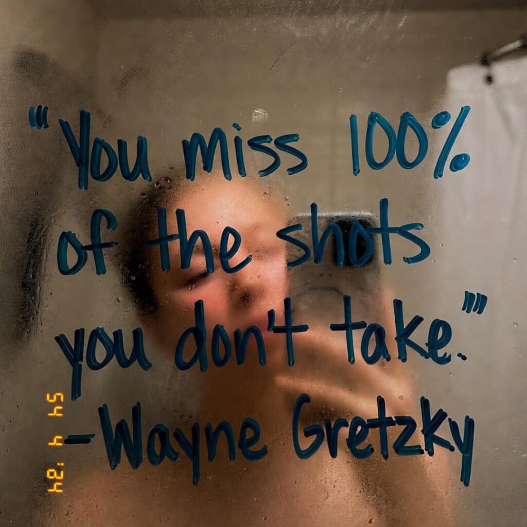 my puffy sleep-deprived face barely visible in the reflection—super unflattering, perfect