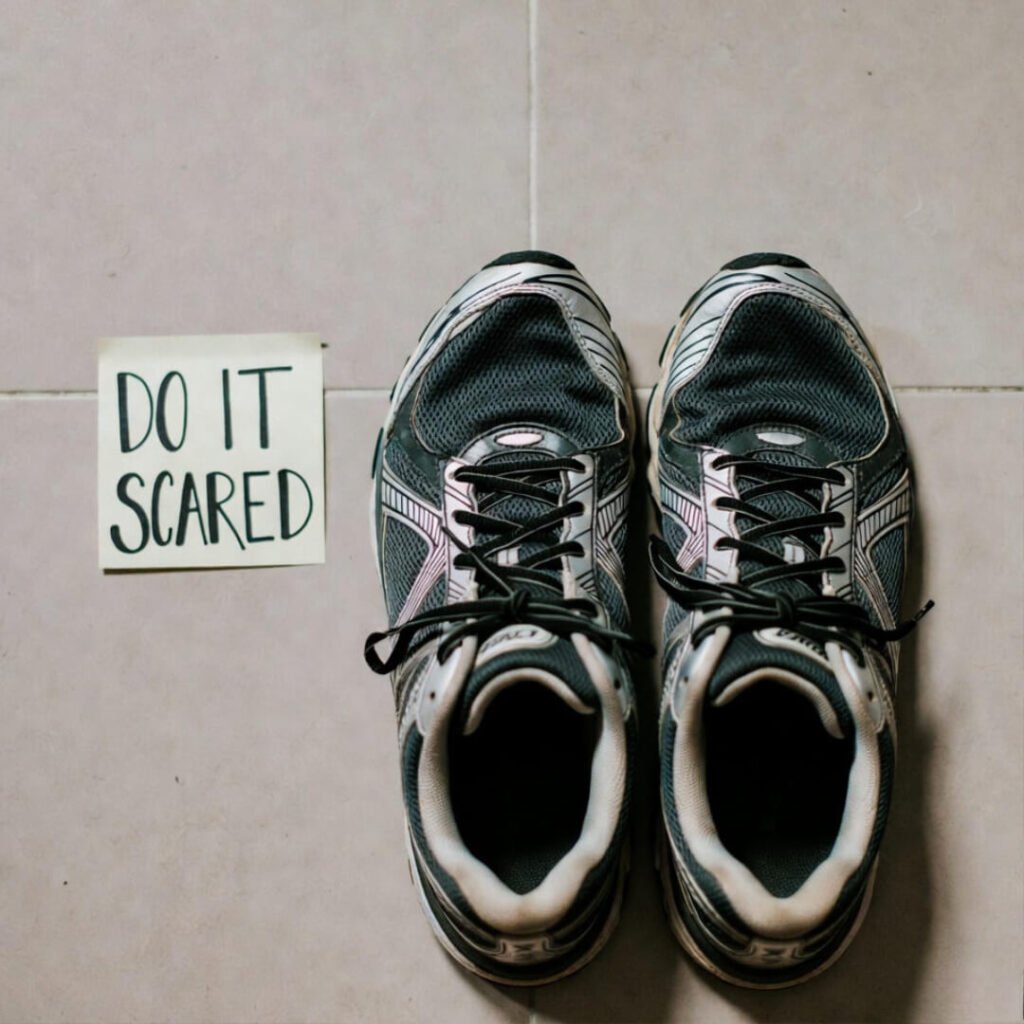 Beat-up shoes with “DO IT SCARED” sticky note