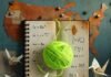 The Best Ways to Improve Your Skills and Expand Your Knowledge Neon yarn tangles notebook on US map.